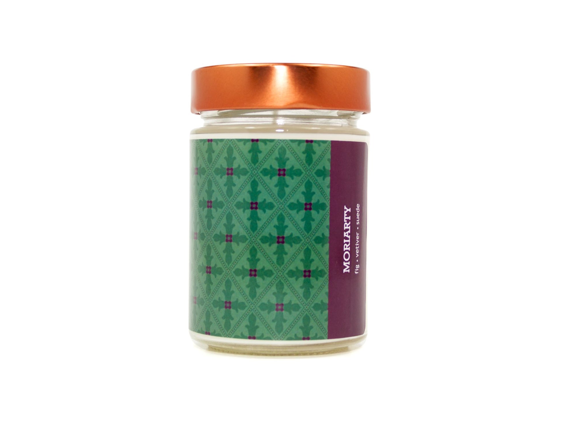 Onset & Rime fig and vetiver scented candle called "Moriarty" in a 10 oz glass jar with copper lid. The label is a deep green gothic-style pattern. The text on the label is "Moriarty - Fig, Vetiver, Suede".