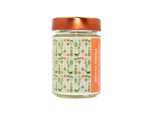 Onset & Rime floral pine scented candle called "Serafina Pekkala" in a 10 oz glass jar with copper lid. The label is pale green with a pattern of pine branches, compasses, a goose and more arctic symbols. The text on the label is "Serafina Pekkala - Geranium, Neroli, Cloud Pine, Arctic Air".