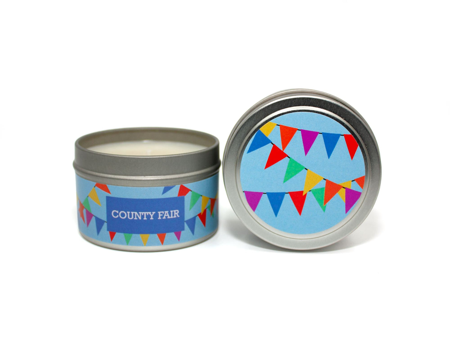 Onset & Rime strawberry rhubarb funnel cake scented candle called "County Fair" in a 4 oz silver tin. The circular label on top has a light blue background with colourful pennant banners. The text on the front label is "County Fair - Strawberry, Rhubarb, Funnel Cake".